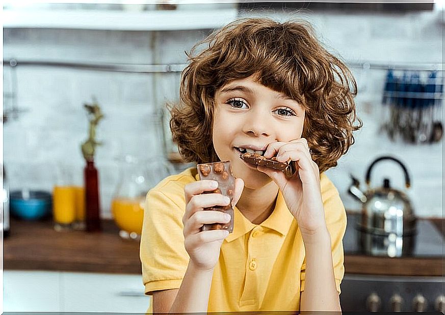 Child eats chocolate to strengthen intellectual performance