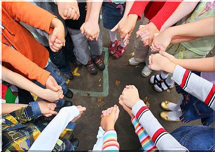 Socialization - a group of children holding hands