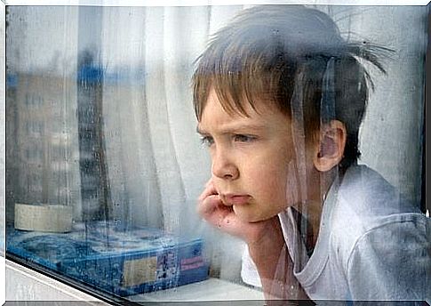 Child with child frustration looks out the window.