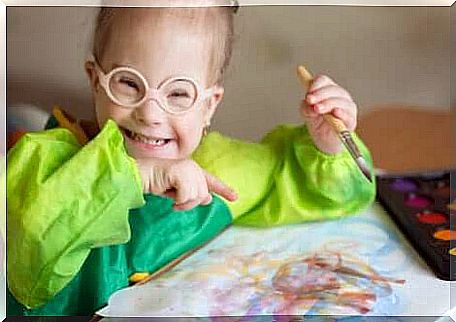 Children with intellectual disabilities: laughing child with Down syndrome