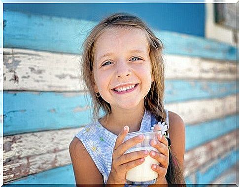 Anemia prevention - girl drinks milk