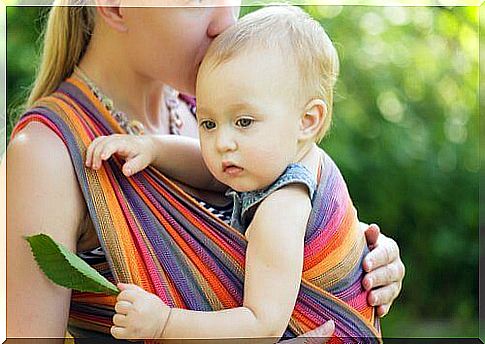 Carrying babies increases the physical contact between the baby and the parents or caregiver.