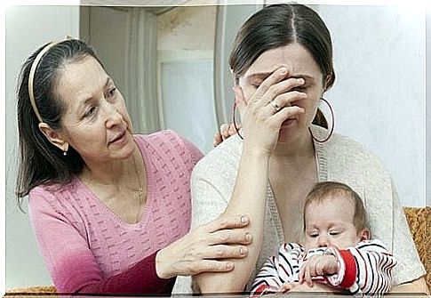 Mothers cry - grandma comforts mom