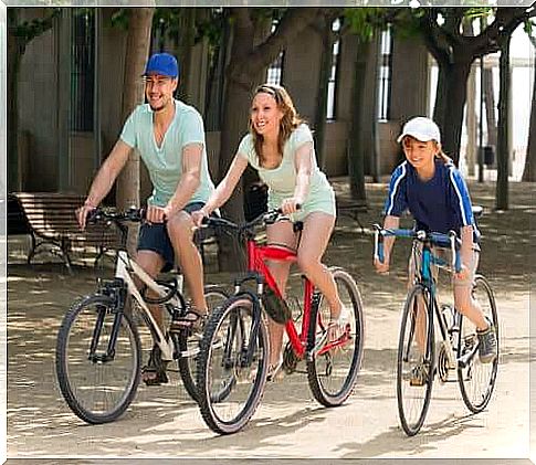 Parents and son on bicycles